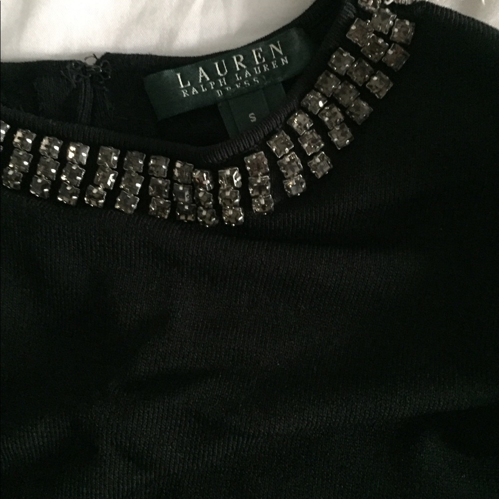 Black short dress with jeweled neckline.